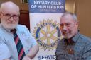 Gerard McGlumpha receives the Rotary Club of Hunterston Community Award cheque from President Alex Blair