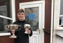 Niall Gallacher with the Club Championship and Cumbrae Cup Trophies