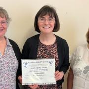 Patricia Gibson receives the award from the Ayrshire WASPI Group