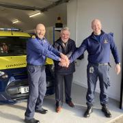 Coastguard official opening:  former Station Officer Luigi Giorgetti cutting the 'ribbon' alongside Coastal Operations Area Commander Robbie Robertson and Senior Coastal Operations Officer Stevie Muldoon.