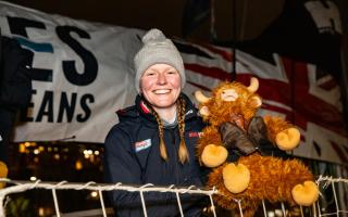 Elizabeth Balmer, with the Our Isles and Oceans mascot, on arrival into Seattle after crossing the North Pacific