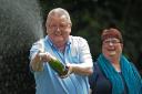 Colin Weir (L) and his wife Chris pose for pictures during a photocall in Falkirk, Scotland, on July 15, 2011, after winning a record GBP161m (184m euros/259m USD) in the EuroMillions Lottery, on July 15, 2011.  The Euro Millions lottery, launched in
