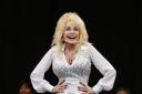 Dolly Parton hands on hips