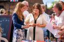 Princess Eugenie with her sister Princess Beatrice, left, at the Coronation Big Lunch in Chalfont St Giles (PA)