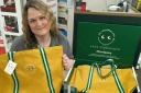 Community champion Lorraine Nicol models the new tote bags