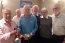 The ‘Four Putters’ captain Howard Gibb (centre) and his team of Shanks and Kate Jack and Tom Sirel (right) receive the Hunterston Rotary Club Quaich from Alex Blair (left) with quiz master Jim Jackson in attendance