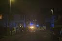 Police block road as fire crews attend to emergency