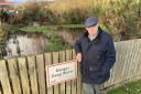 David Telford at the SUDS pond at Dawn Homes' development in Fairlie