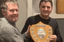 Angus Middleton being presented with the Ross Roy Memorial Shield by AABC president Martin Cassidy