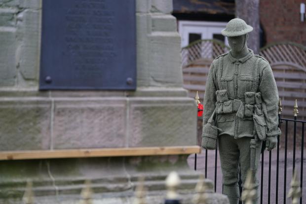A life-sized knitted soldier
