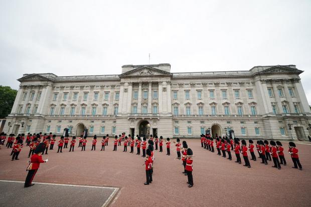 Largs and Millport Weekly News: Members of the Nijmegen Company Grenadier Guards and the 1st Battalion the Coldstream Guards take part in the Changing of the Guard, in the forecourt of Buckingham Palace. Picture: PA
