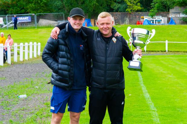 Largs and Millport Weekly News: Thistle manager Stuart Davidson with John Grant's son, James.