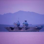 Aircraft carrier sails past Largs in early morning visit