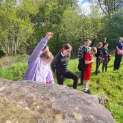 St Mary's Primary pupils at the Haylie chambered cairn in Douglas Park