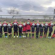 Young footballers were delighted with their new footballs