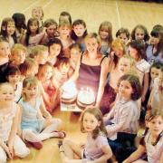 Largs Brownies celebrate their 90th birthday with leader Pauline Green holding the cakes