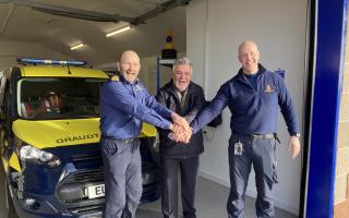 Coastguard official opening:  former Station Officer Luigi Giorgetti cutting the 'ribbon' alongside Coastal Operations Area Commander Robbie Robertson and Senior Coastal Operations Officer Stevie Muldoon.
