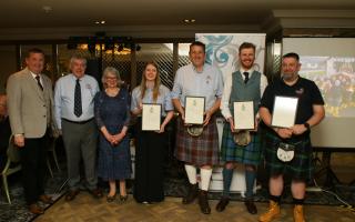 Volunteer crew with their commendations at the Largs RNLI's anniversary dinner.