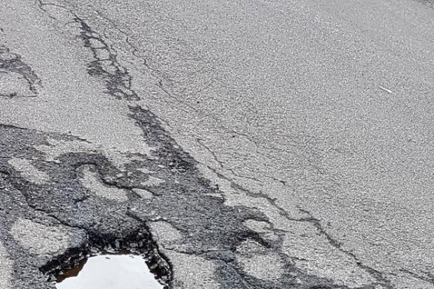 Letters to the Editor ... Adopt a Pothole
